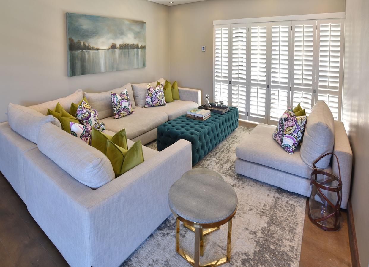 Tredenham Boutique Hotel Блоемфонтейн Екстериор снимка A living room with plantation shutters